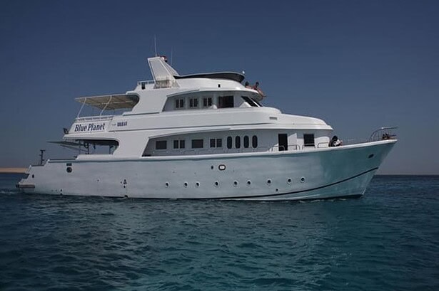 The Blue Planet 1 liveaboard cruising the Red Sea with its full hull and sun deck visible