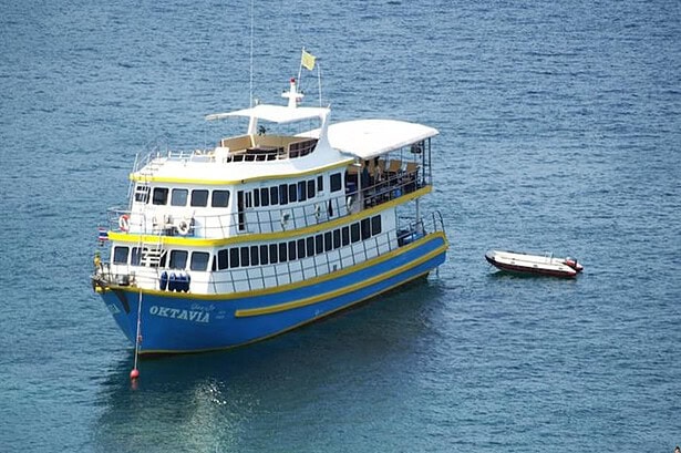 Aerial view of the Oktavia liveaboard boat anchored in turquoise water