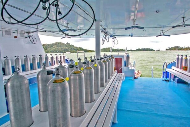 Rows of scuba tanks lined up on the dive deck of the Manta Queen 3 liveaboard