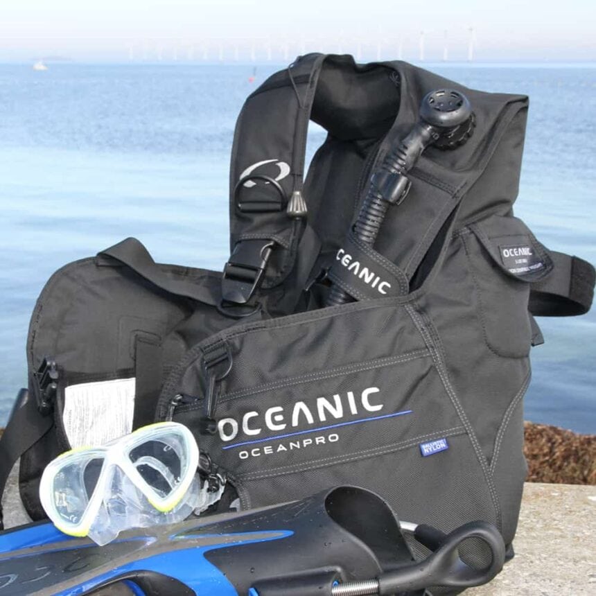 Oceanic OceanPro BCD Test Kit Oceanic OceanPro BCD set up with mask and fins on a seawall before a test dive