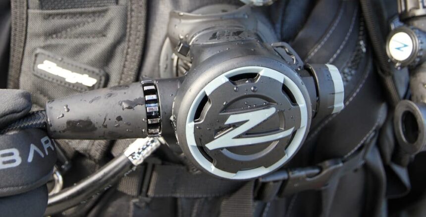 Zeagle F8 Second Stage After Test Dive Wet Zeagle F8 second stage clipped to a black BCD, still dripping after a dive
