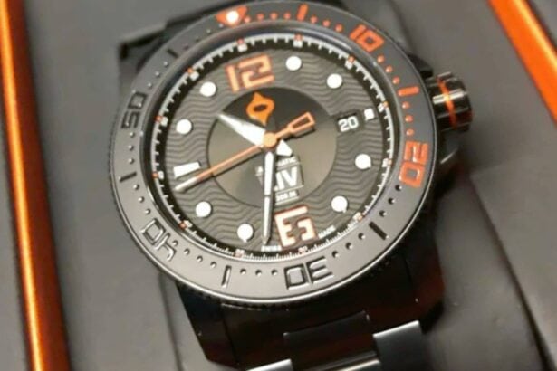 Blacked-out LIV GX Diver with orange bezel markings resting in its presentation case