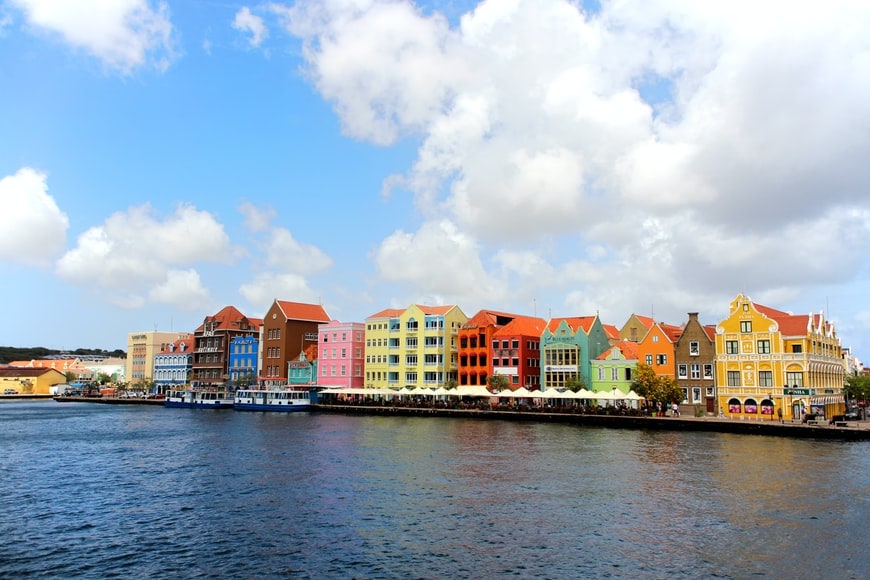 Colorful Dutch colonial buildings line the waterfront in Willemstad, Curacao