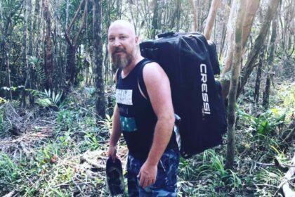 Our tester carrying the Cressi Moby 5 trolley dive bag on his back through dense jungle