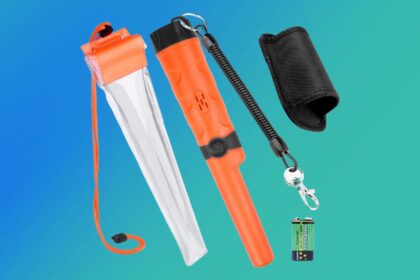 Orange Kuman pinpointer with a clear waterproof tube, belt holster, coiled lanyard and 9V battery