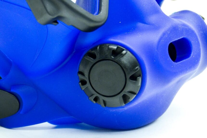 OTS Spectrum Side Valve Detail Close-up of the round black valve set into the side of the blue OTS Spectrum full face mask
