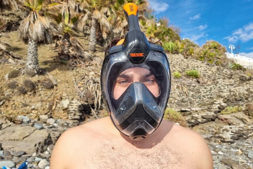 SEAC Unica Full Face Mask Front View DIVEIN tester wearing the SEAC Unica full face snorkel mask on a rocky beach, seen head on