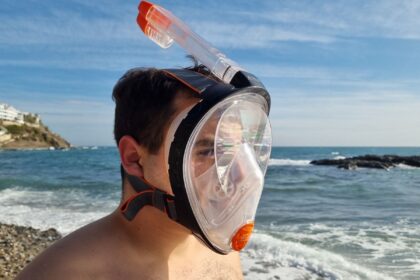 Our tester wearing the Ocean Reef Aria Classic full face snorkel mask, seen from the right side