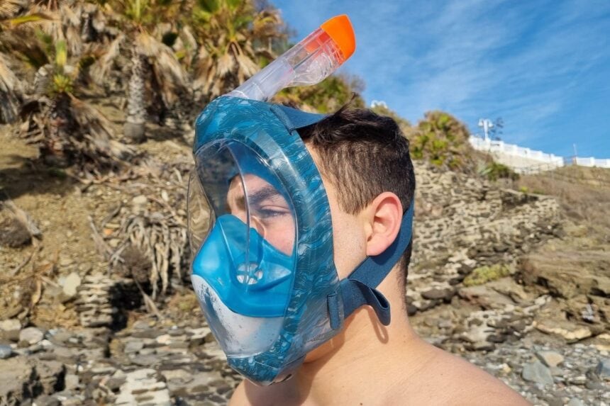Side view of our tester in the Subea Easybreath 500, clear snorkel tube with orange tip above