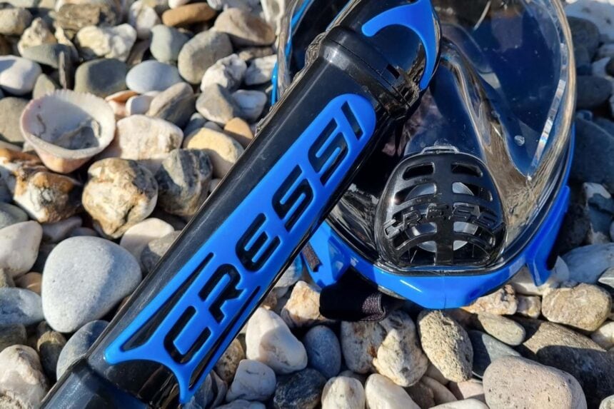 Cressi Duke Snorkel Tube Close Up Close-up of the Cressi branded snorkel tube and the Duke mask's breathing valve grille on pebbles