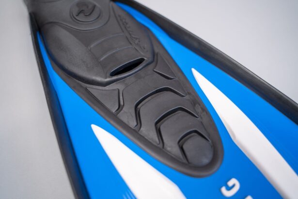 Close-up of the black rubber foot pocket on the Aqua Lung Express where it meets the blue blade
