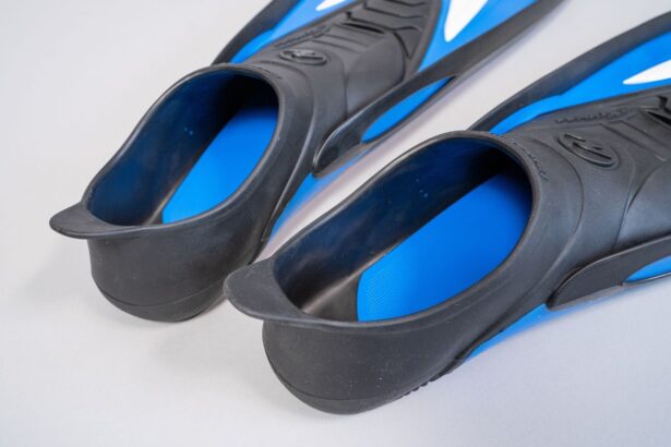 Looking down into the heel openings of a pair of Aqua Lung Express fins with blue textured footbeds