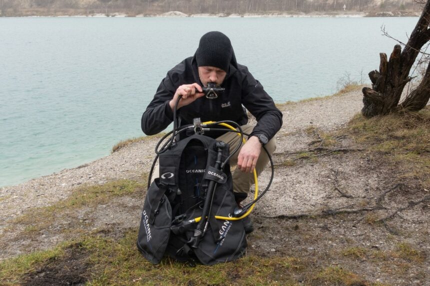 Torben Testing The Oceansport Inflator DIVEIN tester Torben blowing into the Oceanic Oceansport's oral inflator at the water's edge