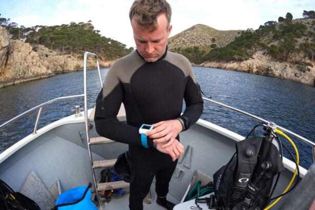 DIVEIN tester checking a wrist dive computer on the boat, with the Oceansport BCD rigged behind him