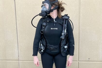 Our tester geared up in the Bare Evoke wetsuit with a full face mask and BCD before a dive