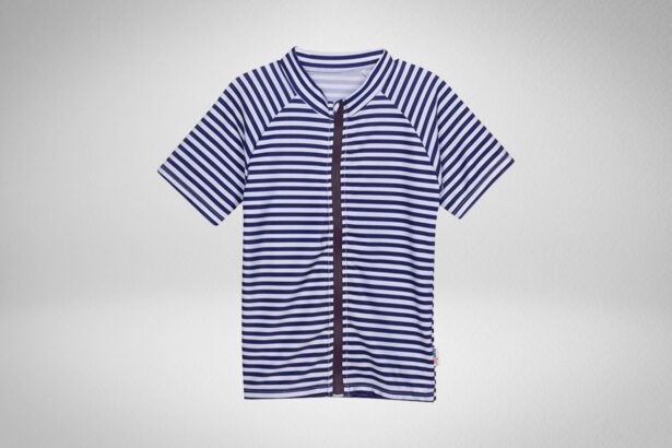 SwimZip kids short sleeve rash guard in navy and white stripes with a full-length front zipper