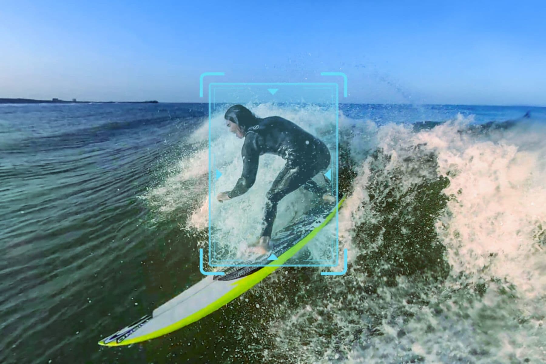 Surfer riding a wave with the Insta360 tracking frame locked around them on screen