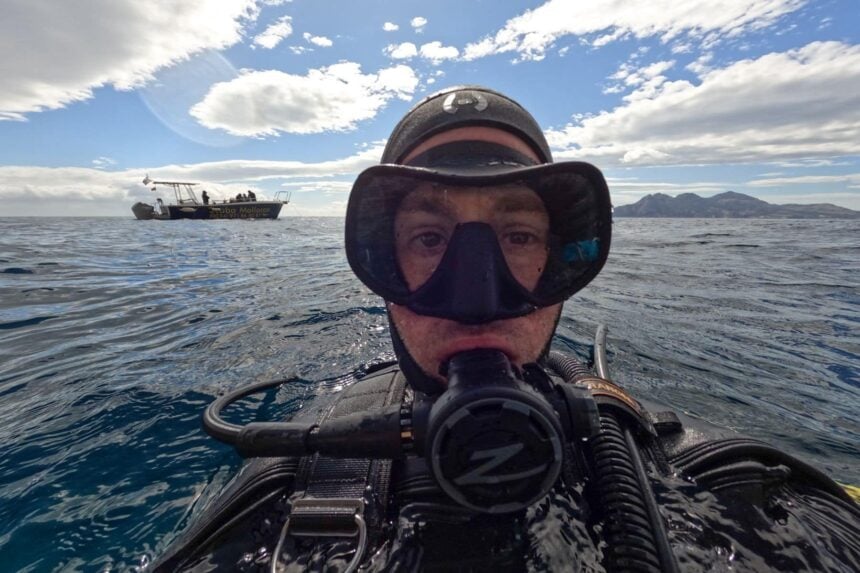 Zeagle Scope Mono Tested at the Surface DIVEIN tester at the surface in the Zeagle Scope Mono with the dive boat behind him