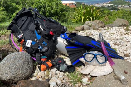 Zeagle Zena BCD rigged to a tank with fins, mask and snorkel laid out on rocks before a DIVEIN test dive