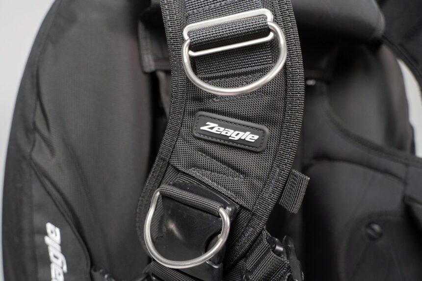 Zeagle Shoulder Strap D-Ring Detail Close-up of a stainless steel D-ring on the padded shoulder strap of the Zeagle BCD