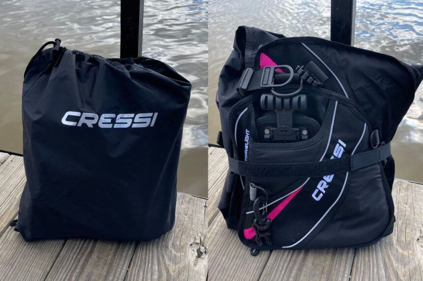 Cressi Travelight BCD next to its Cressi drawstring carry bag on a lakeside dock