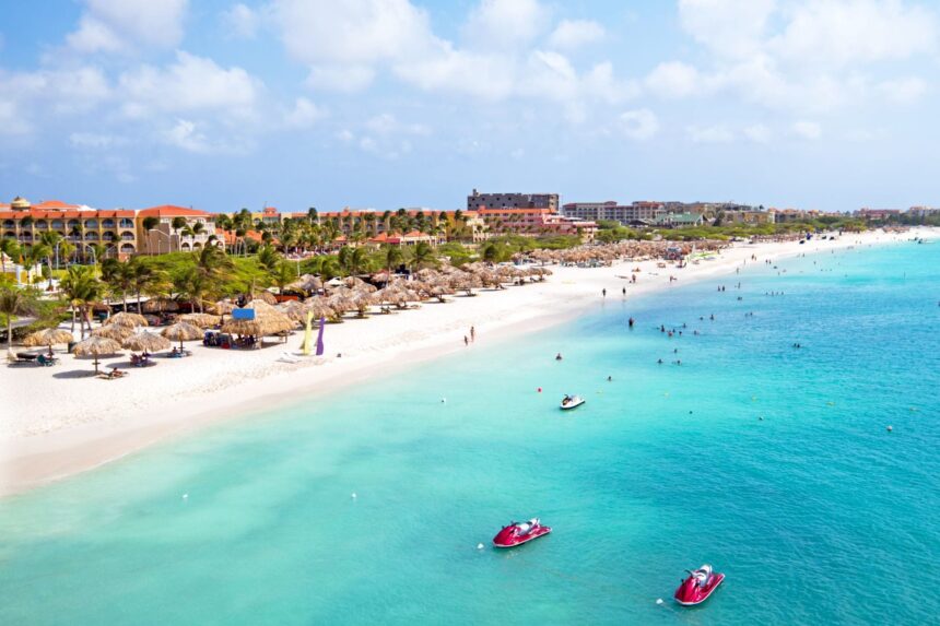 Eagle Beach Umbrellas Palm-thatched umbrellas line the white sand shore of Eagle Beach in Aruba