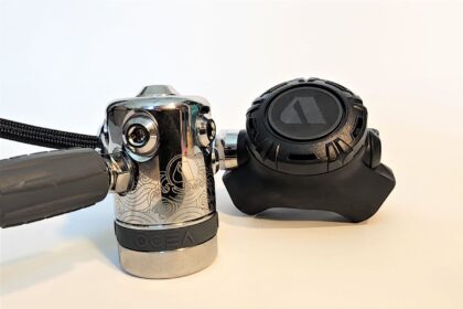 Apeks Ocea first stage with engraved chrome body next to its black second stage
