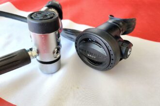 Sherwood Brut Pro first stage and second stage regulator on a red and white cloth