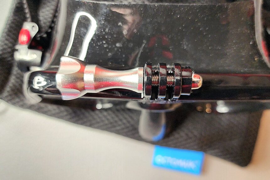 Close-up of the embedded nut and thumbscrew that lock the camera mount onto the Octomask
