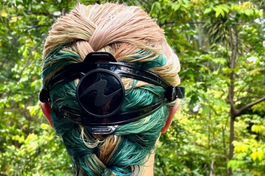 Aqualung Reveal X1 split strap and logo on the back of our tester's head outdoors
