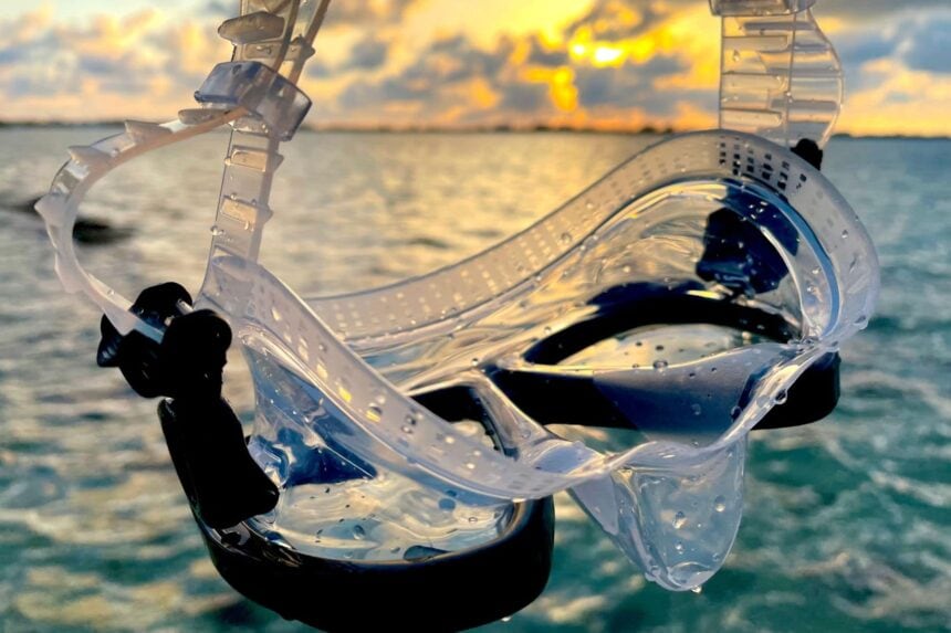 Genesis Icon Clear Skirt At Sunset Genesis Icon mask with clear silicone skirt held against a sunset over the water