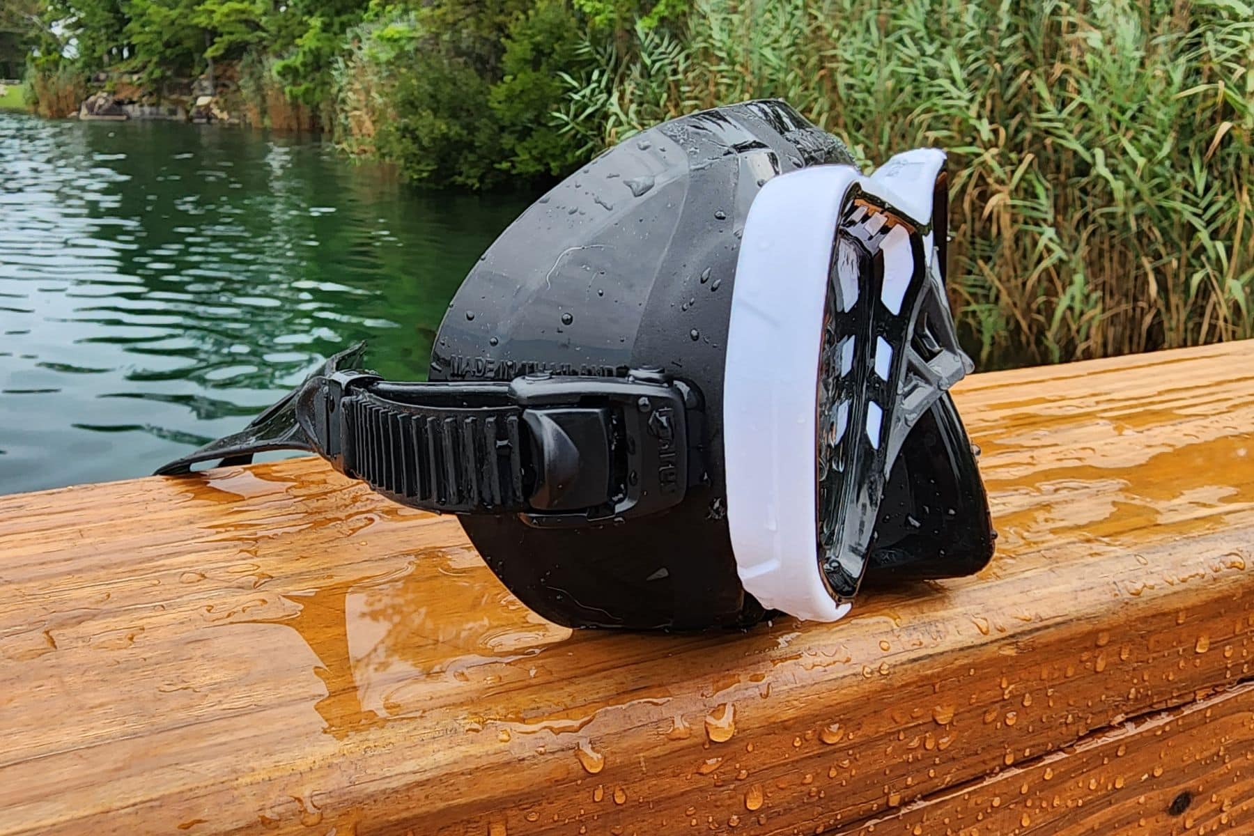 Side view of the Mares Spyder on a wet wooden rail with a lake behind