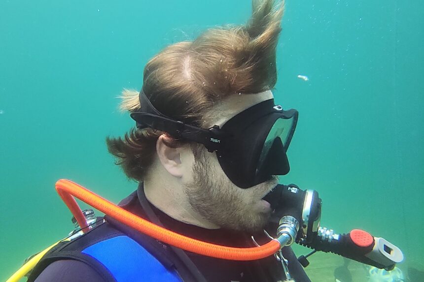 Side view of our tester wearing the TUSA Zensee Pro on an open water test dive