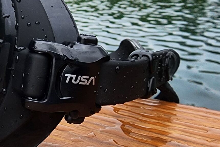 Close-up of the TUSA branded 3D buckle and strap on the wet Zensee Pro