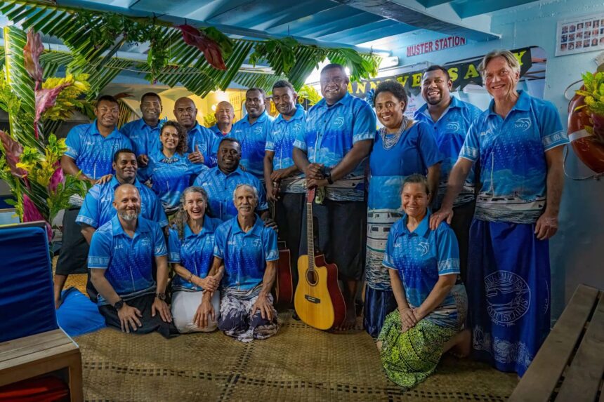 Nai'a crew and guests pose together for an anniversary celebration photo