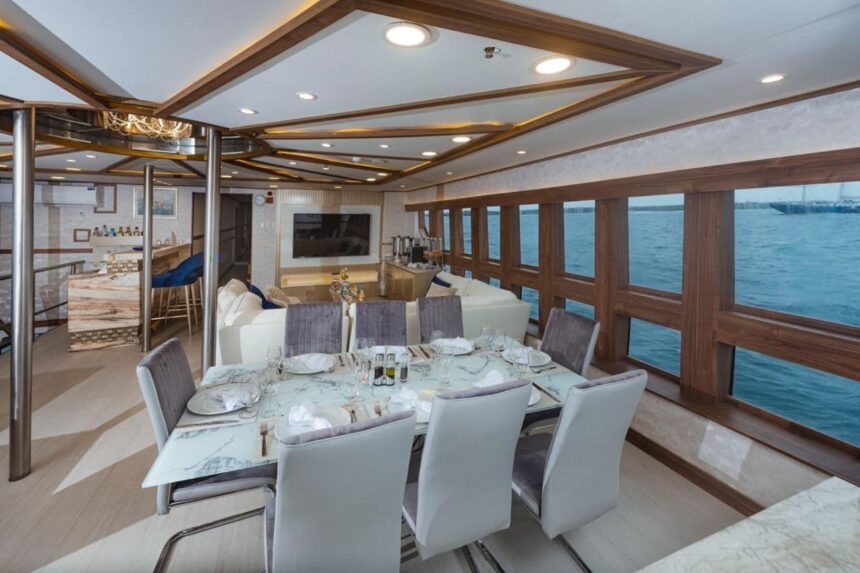 Loungers and a sofa on the Tiburon Explorer's open air deck under grey sky
