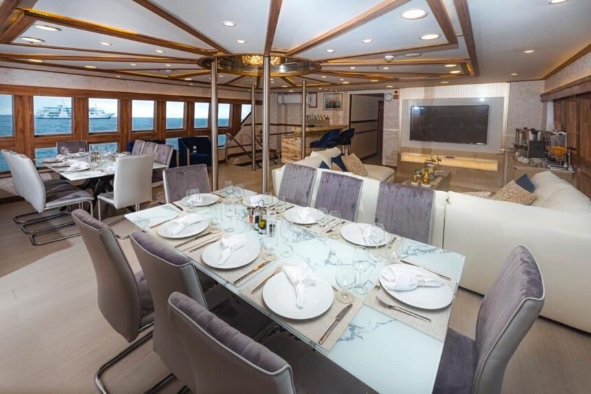 Rolled blue towels and scuba tanks staged on the Tiburon Explorer's dive deck