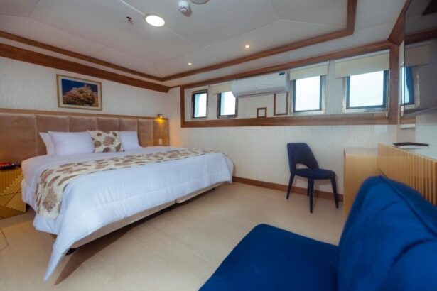 A sectional sofa and gold chandelier in the Tiburon Explorer's lounge