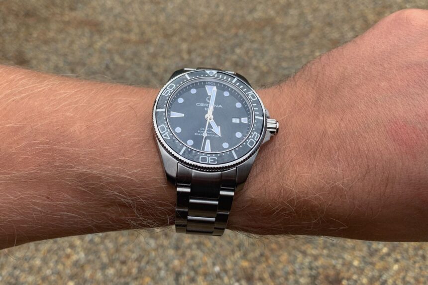 Our reviewer wearing the Certina DS Action Diver on its steel bracelet, dial facing the camera