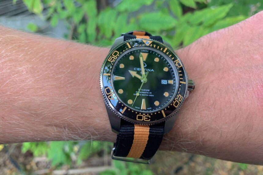 Certina DS Action Diver with green dial and titanium case worn on a wrist outdoors