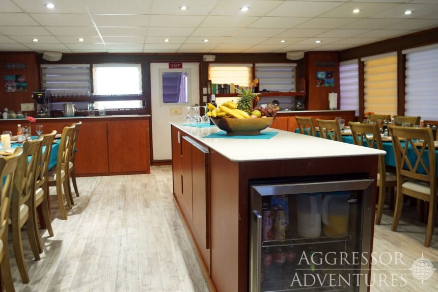 Galley and dining area aboard the Belize Aggressor IV with a bowl of tropical fruit