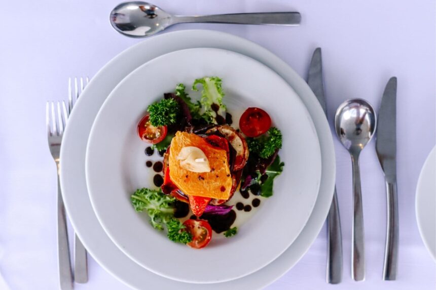 plated roasted vegetables and greens with balsamic drizzle on the Fiji Princess
