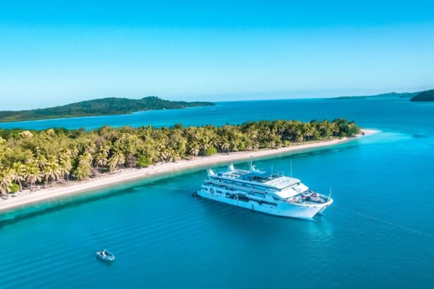 aerial view of the Fiji Princess with a tender boat trailing a wake