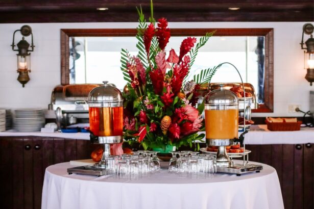 Tropical flower centerpiece beside drink dispensers on the Fiji Princess dining table