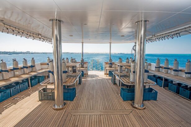 Scuba tanks and gear crates arranged along the covered dive deck