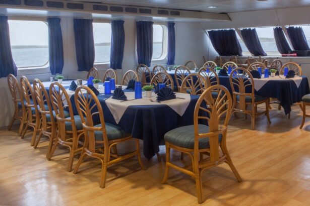 Dining tables set with navy linens and napkins in the Aqua Cat's salon