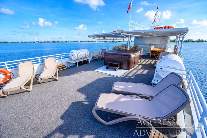 Sun loungers and a hot tub on the open top deck of the Cayman Aggressor IV