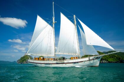 Emperor Raja Laut liveaboard schooner sailing under full white sails