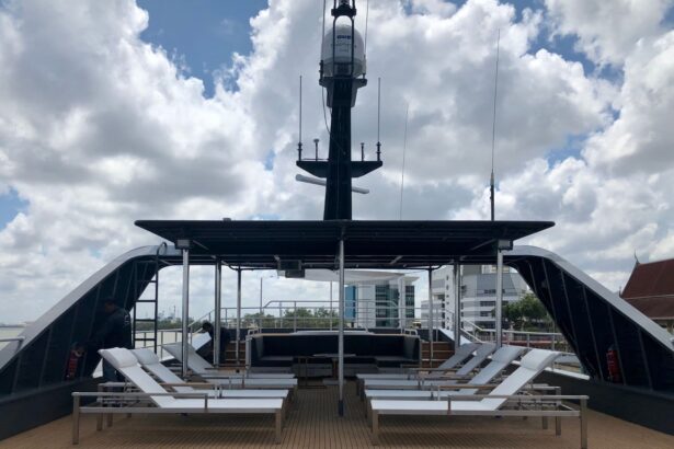 Rooftop sundeck of the All Star Velocean with sun loungers and a communications mast