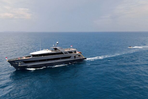 Side profile of the All Star Velocean cruising across calm open sea